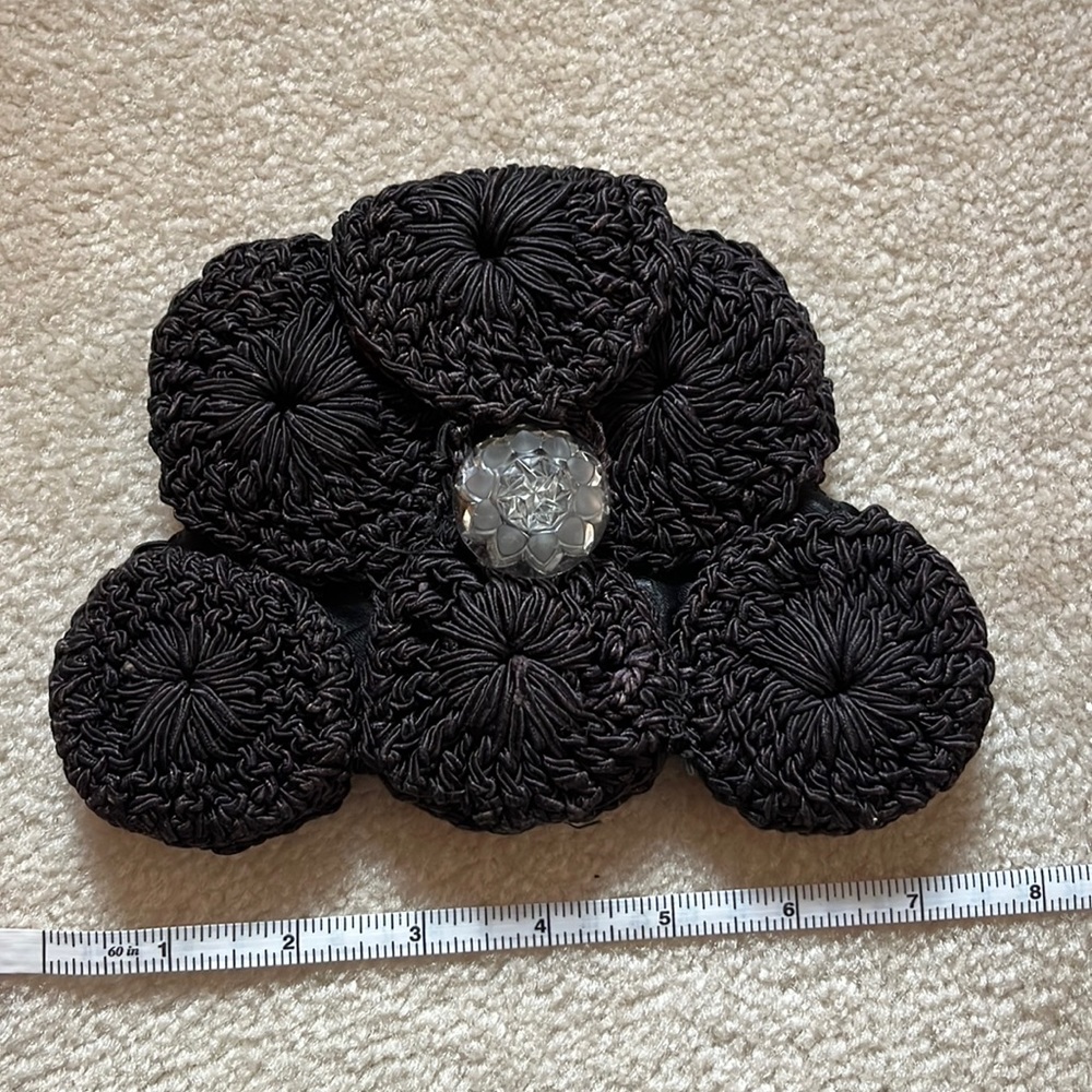 Black wristlet crochet looks like handmade. Vintage